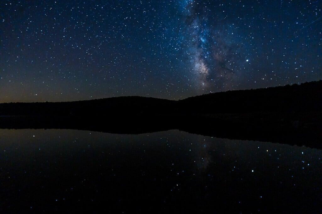 Photograph of the Milky Way over and reflected in Spruce Knob Lake, Spruce Knob, West Virginia